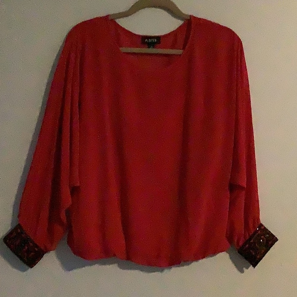 A. Buyer red blouson top w/black trim wrist - XL
